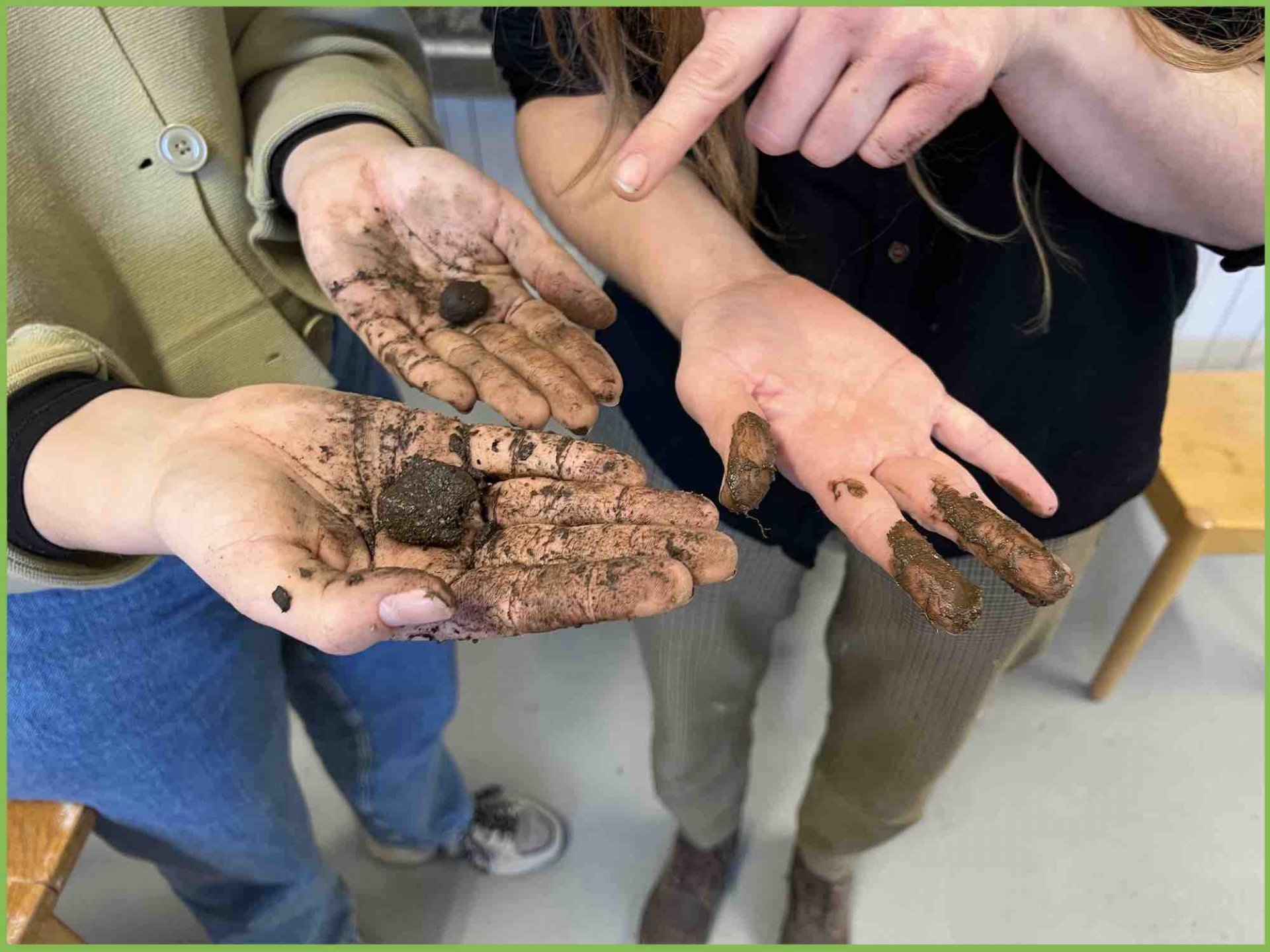 Photo of clumped soil in testers' hands 
